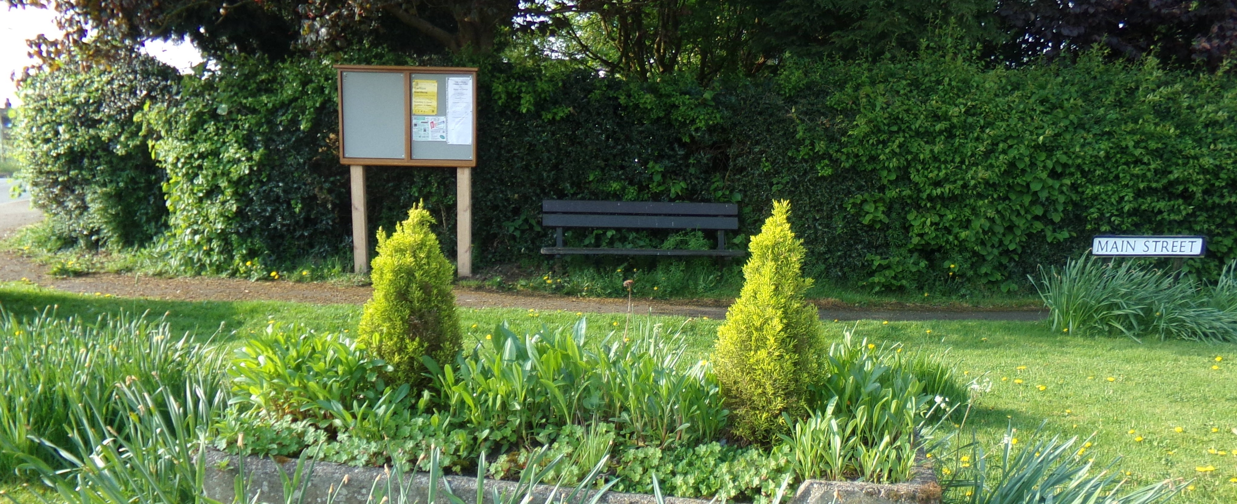 New noticeboard next to seat at eastern end of Main Street
